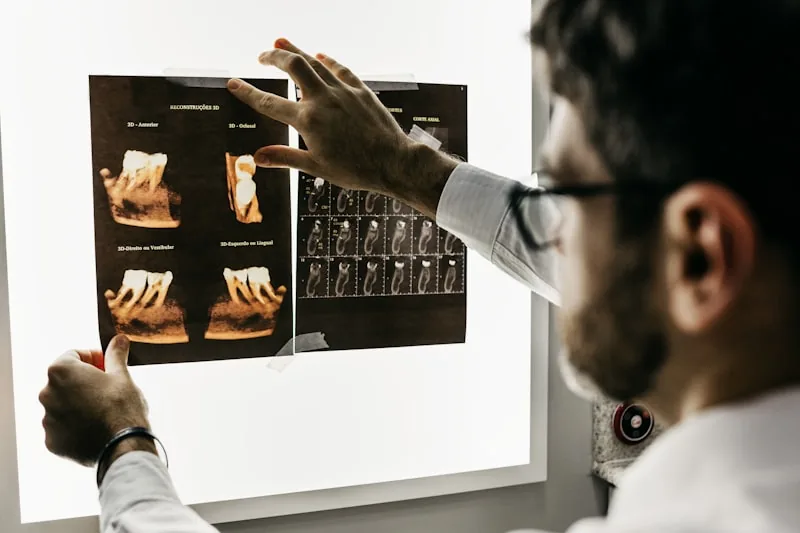 Dentist reviewing dental X-rays