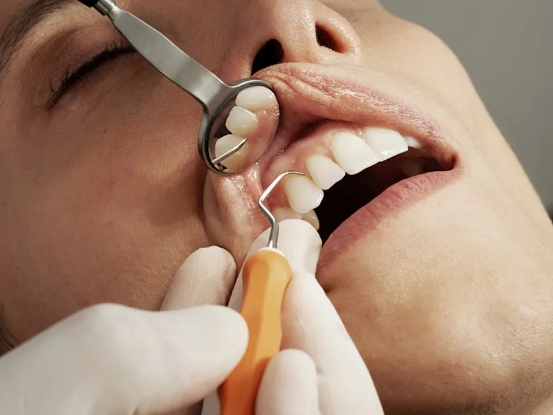 Dentist performing a careful dental examination